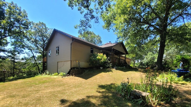 view of home's exterior with a lawn