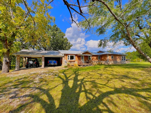 single story home featuring a carport and a front lawn