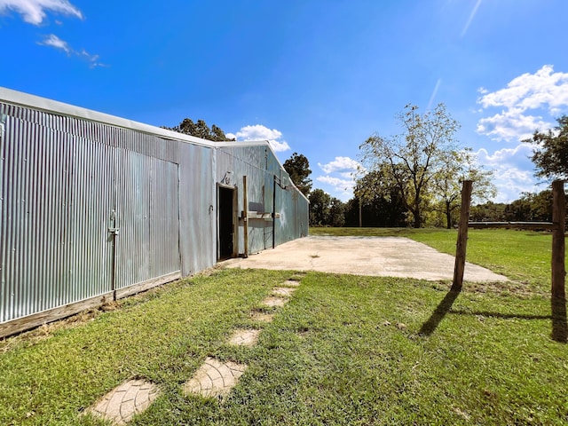 view of yard with an outbuilding and a pole building