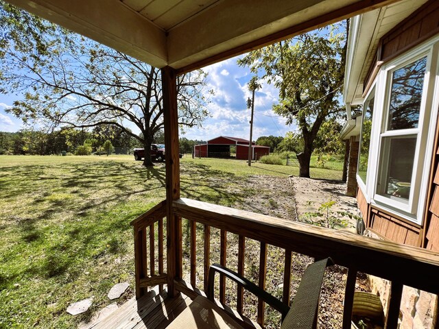 wooden deck with a lawn