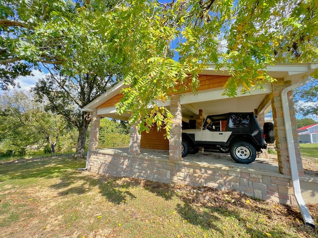 view of home's exterior with a lawn and a carport