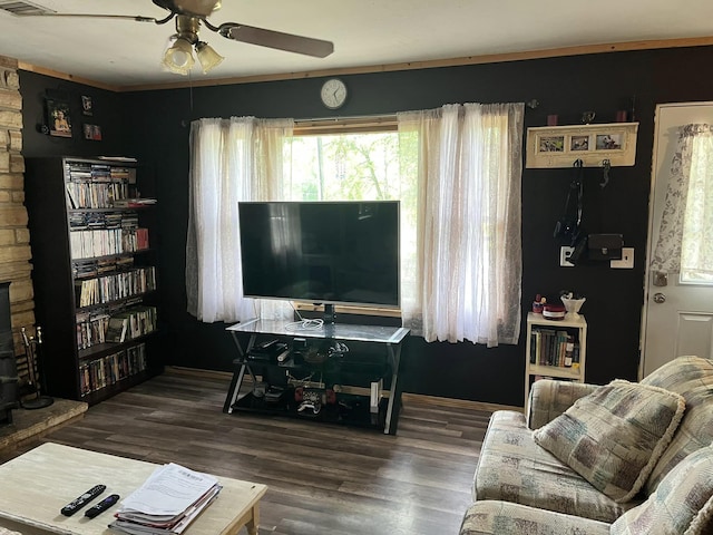 1100 Hattie Dr, Willow Springs, MO 65793 - living area featuring a ceiling fan, wood finished floors, visible vents, and a fireplace