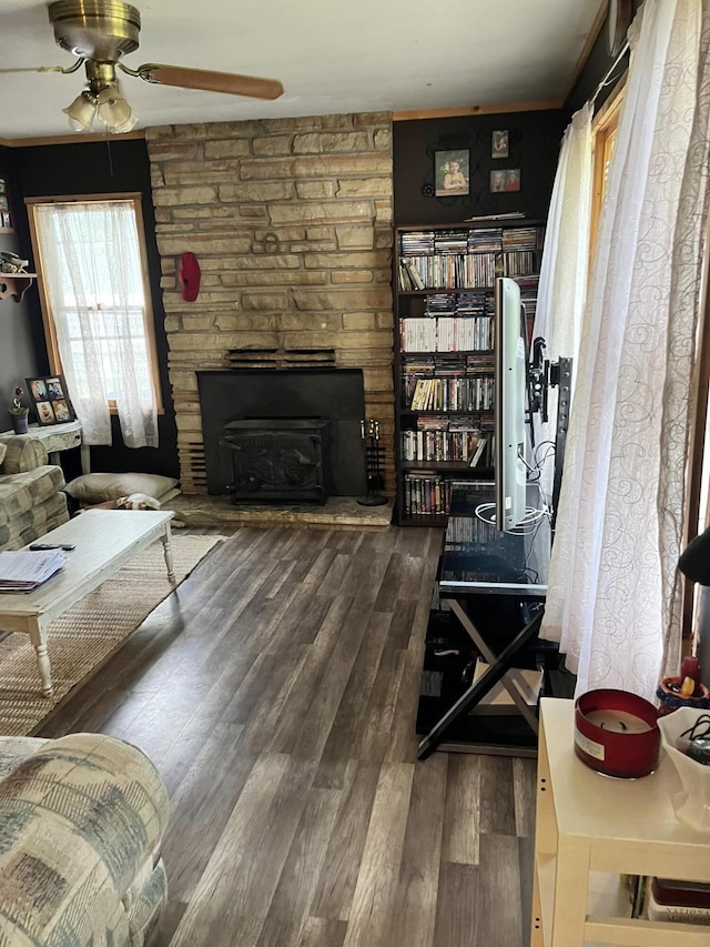 living room with dark hardwood / wood-style floors and ceiling fan