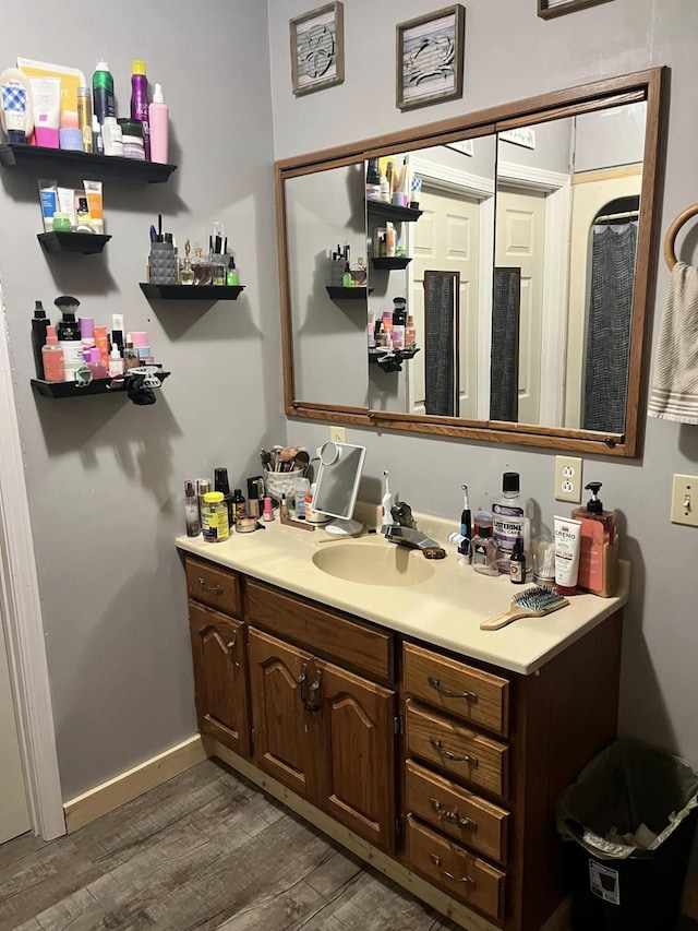 bathroom featuring vanity and hardwood / wood-style floors