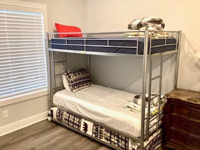 bedroom with wood-type flooring