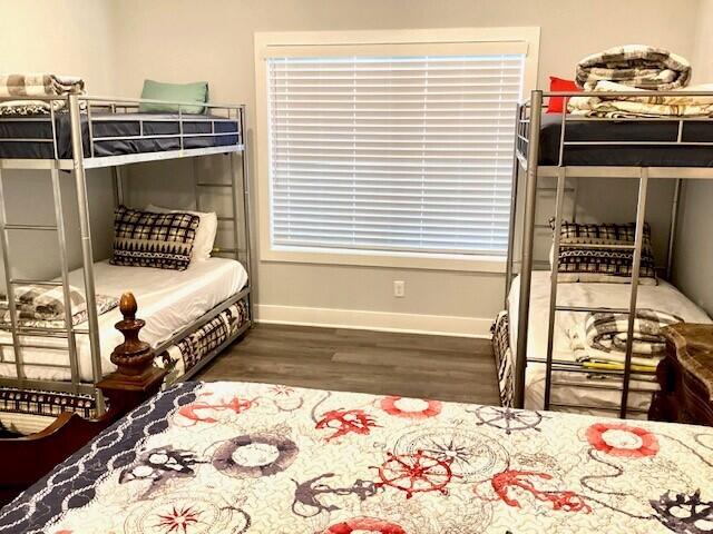 bedroom featuring dark wood-type flooring