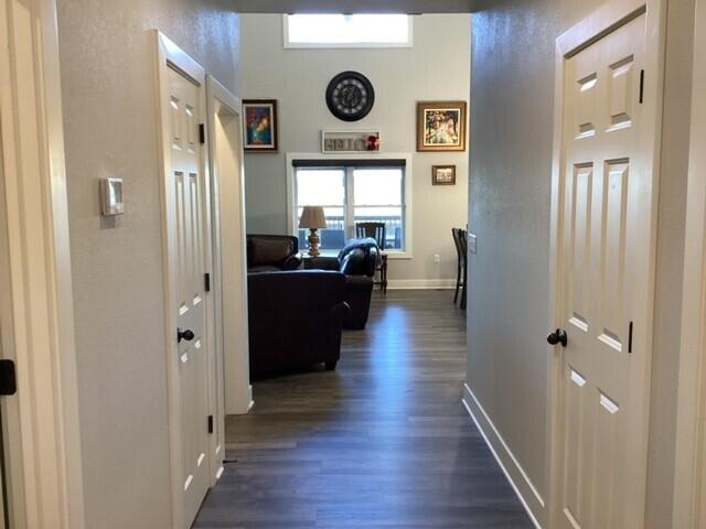 hallway featuring dark wood-type flooring