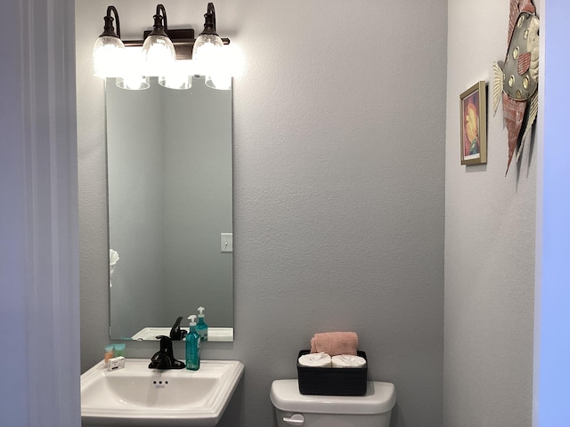 bathroom with sink and toilet