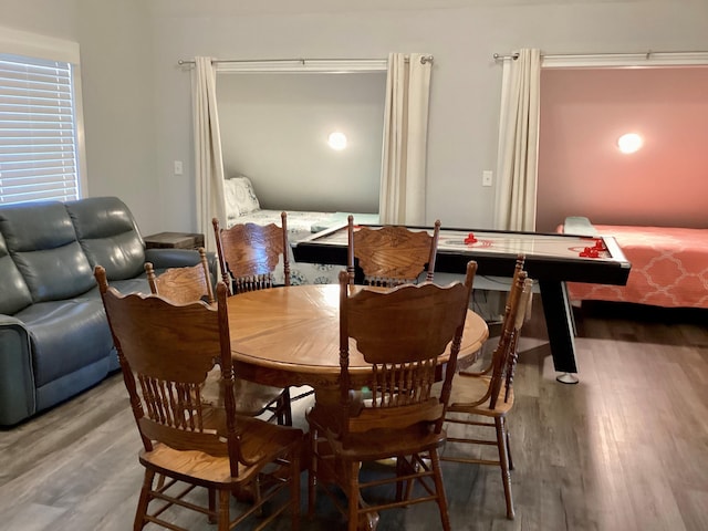 dining space featuring wood-type flooring