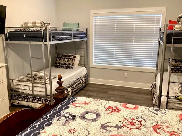 bedroom featuring dark hardwood / wood-style flooring