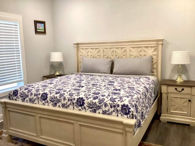 bedroom featuring dark hardwood / wood-style flooring