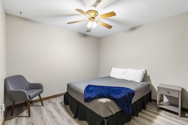 bedroom with light wood-type flooring and ceiling fan