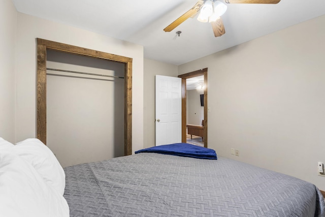 carpeted bedroom with a closet and ceiling fan