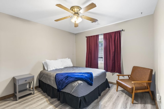 bedroom with ceiling fan and light wood-type flooring