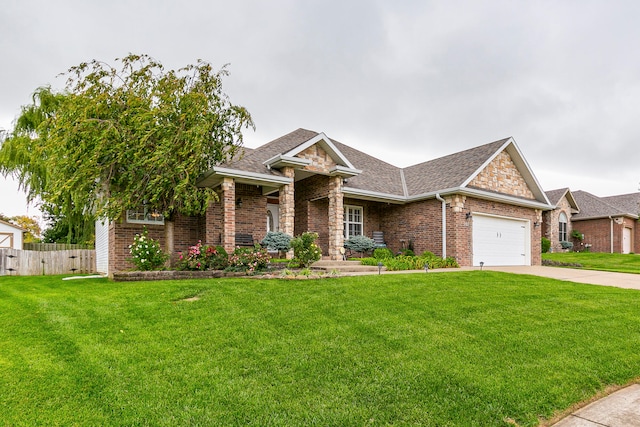 view of front of property with a garage and a front yard