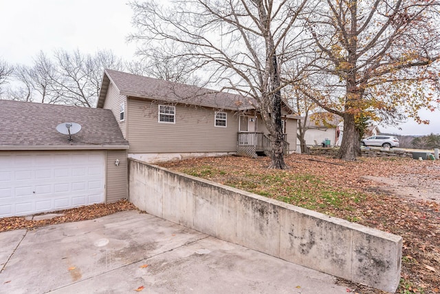 view of property exterior with a garage