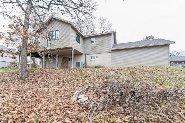 back of house featuring central AC unit