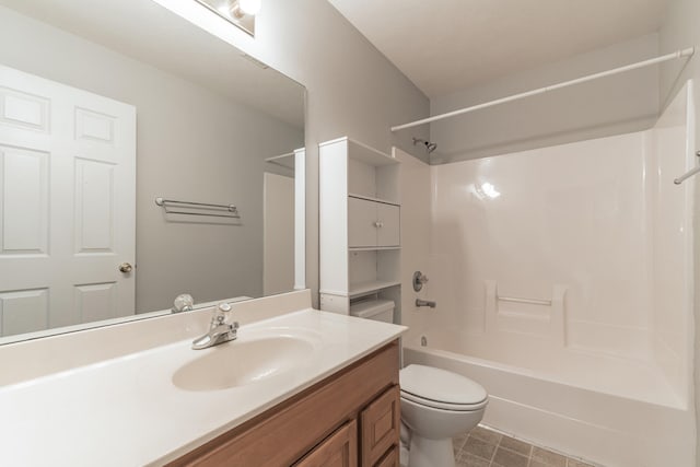 full bathroom with vanity, washtub / shower combination, and toilet