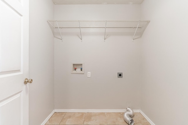 laundry room featuring hookup for a washing machine, light tile patterned floors, and electric dryer hookup