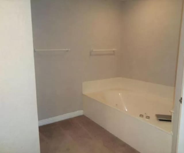 bathroom featuring a garden tub