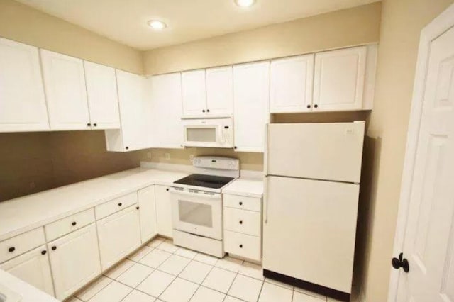 kitchen with white cabinets, recessed lighting, white appliances, light countertops, and light tile patterned floors