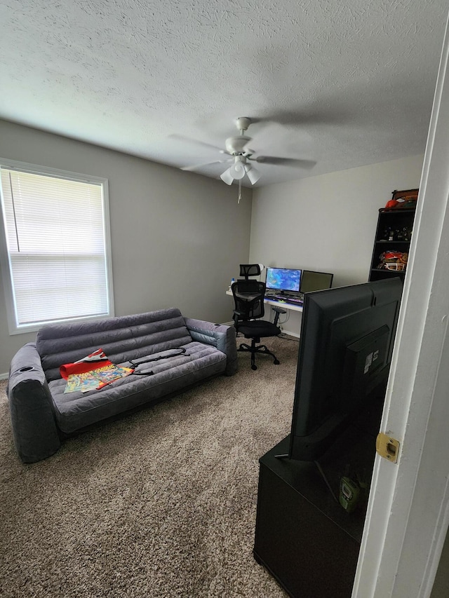 bedroom featuring carpet, a textured ceiling, and ceiling fan