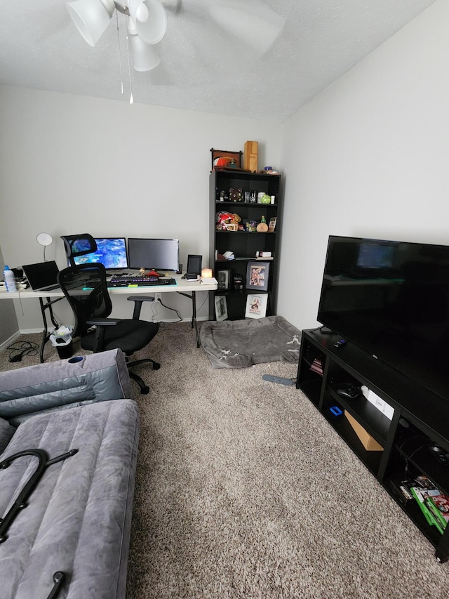 office space featuring ceiling fan and carpet floors