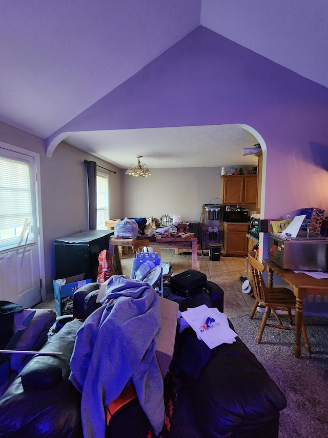 1211 Woodland, Monett, MO 65708 - interior space featuring vaulted ceiling, arched walkways, and light tile patterned flooring