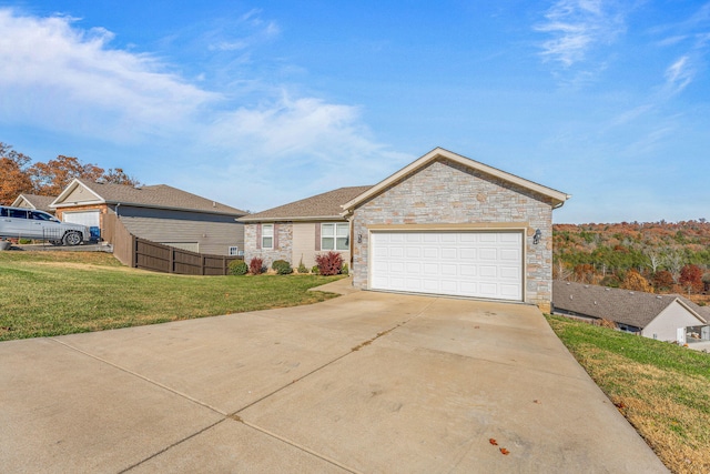 view of front of property with a garage and a front yard