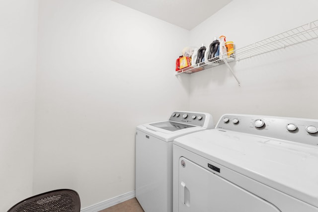 clothes washing area with independent washer and dryer