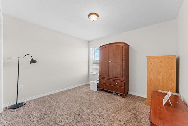 bedroom featuring light colored carpet