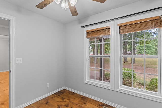 unfurnished room with ceiling fan, a textured ceiling, and hardwood / wood-style floors