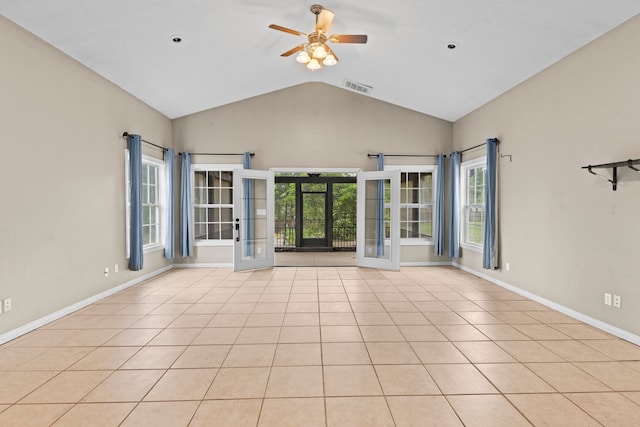 unfurnished living room with plenty of natural light, french doors, light tile patterned floors, and ceiling fan