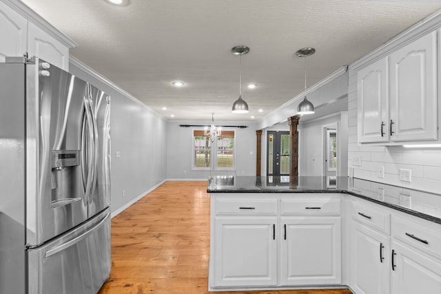 kitchen featuring hanging light fixtures, white cabinetry, ornamental molding, and stainless steel refrigerator with ice dispenser