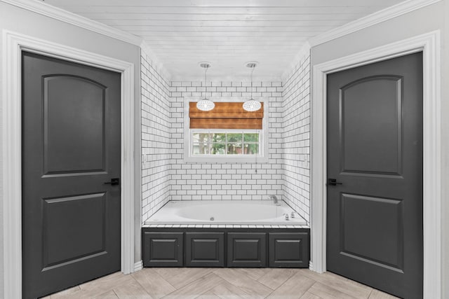 bathroom featuring ornamental molding and a tub to relax in