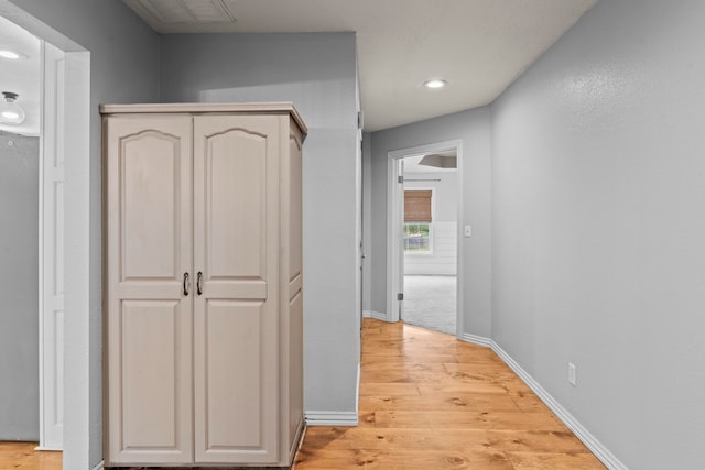 corridor featuring light hardwood / wood-style floors