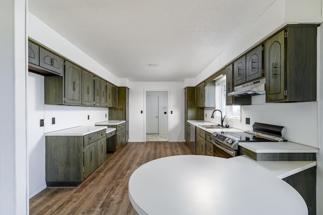 kitchen with dark brown cabinetry, sink, dark hardwood / wood-style floors, electric stove, and a textured ceiling