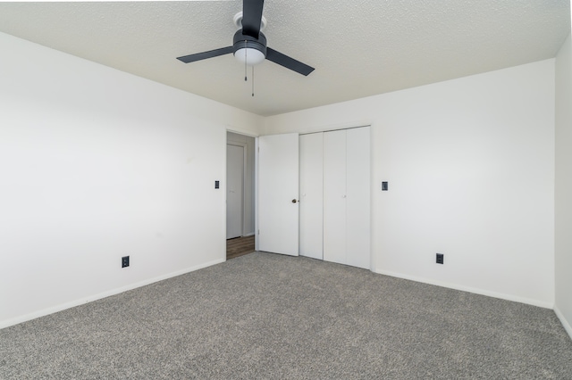 unfurnished bedroom featuring a closet, carpet flooring, and ceiling fan