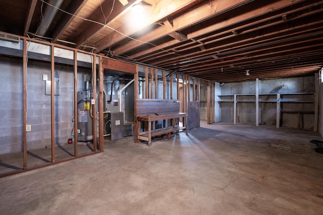 basement with heating unit and water heater