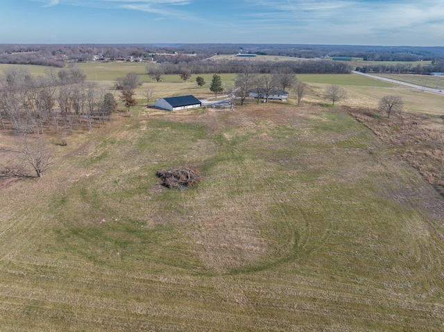 birds eye view of property featuring a rural view