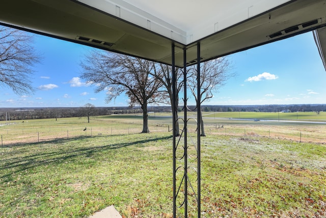 view of yard with a rural view