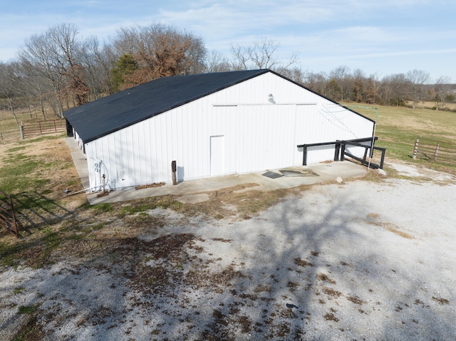 view of outdoor structure with a rural view