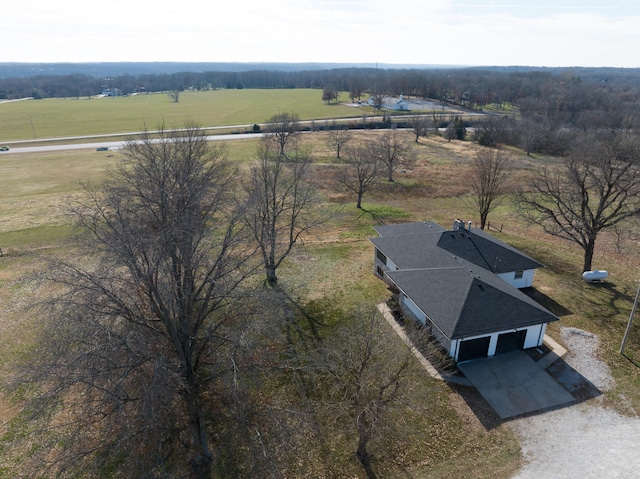 birds eye view of property featuring a rural view