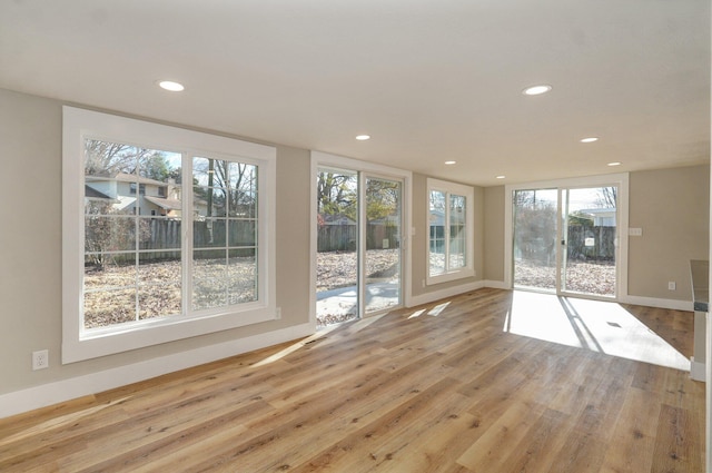 interior space featuring light hardwood / wood-style flooring and a wealth of natural light