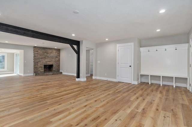 1960 E Meadow Dr, Springfield, MO 65804 - unfurnished living room featuring light wood finished floors, a fireplace, baseboards, and recessed lighting