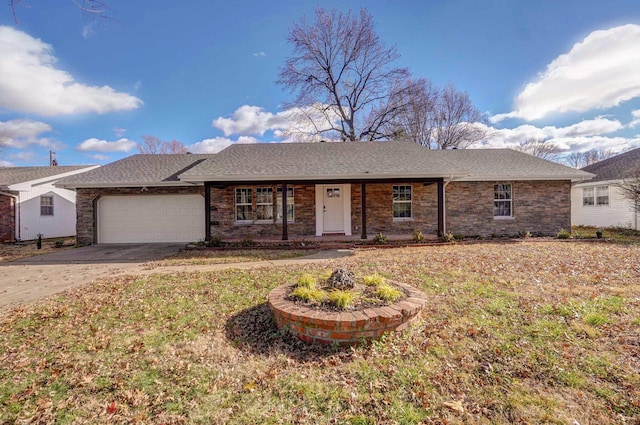 ranch-style home with a garage and a front lawn