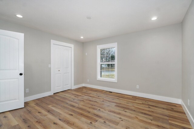 1960 E Meadow Dr, Springfield, MO 65804 - unfurnished bedroom with recessed lighting, baseboards, and wood finished floors