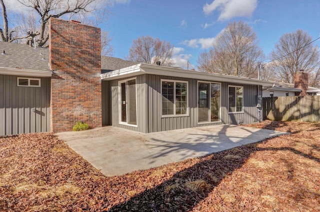 back of property with a patio