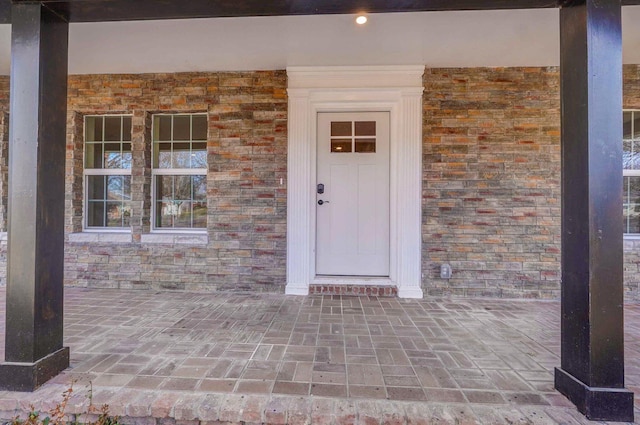 1960 E Meadow Dr, Springfield, MO 65804 - property entrance featuring a porch and stone siding