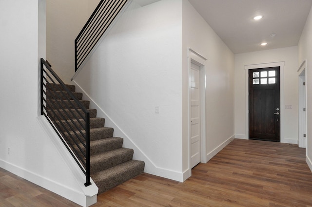 foyer entrance featuring wood-type flooring